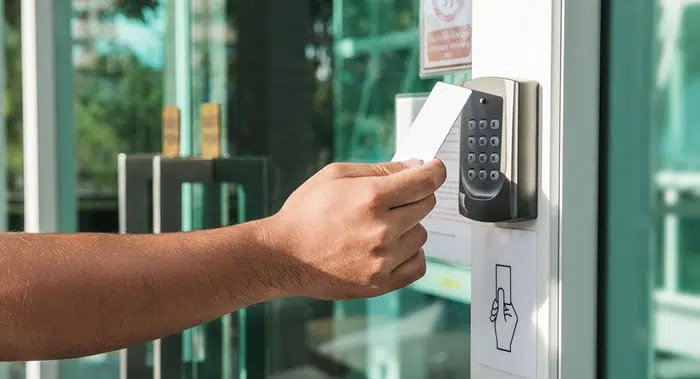 Using a keycard to unlock the door to a business